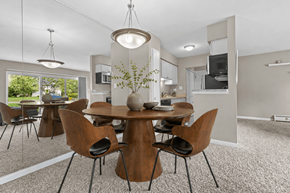 Livonia apartment for rent - A modern dining room with a round table and chairs.