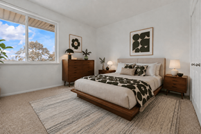 Saline apartment for rent - A bedroom with a large bed and a window.