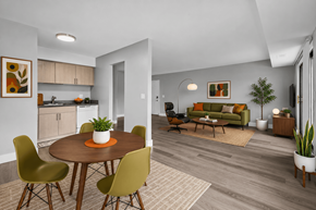 Northville apartment for rent - A modern dining room with a round table and chairs.