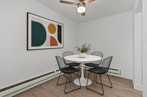 Roseville townhouse for rent - A dining room with a white table and chairs.