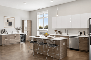White Lake apartment for rent - A modern kitchen with a dining table and chairs.