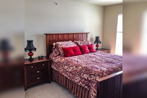 Petoskey apartment for rent - a bedroom with a bed and two night stands