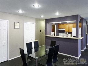 Dearborn Heights townhouse for rent - A dining room with a glass table and chairs.