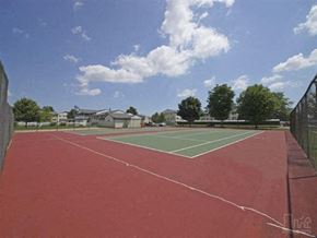 Westland apartment for rent - a tennis court with trees and houses in the background
