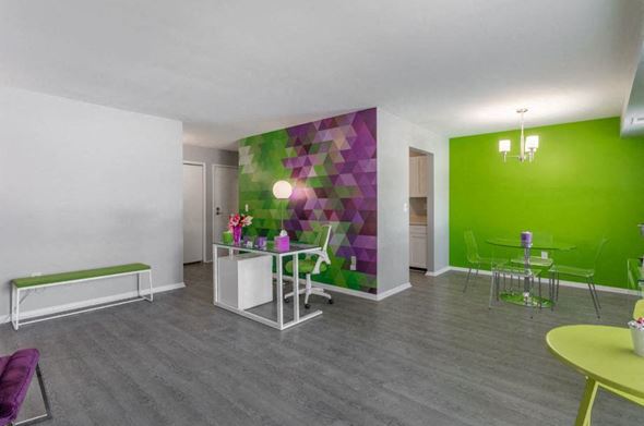 Southfield apartment for rent - a room with a green wall and a white table and chairs