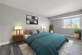 Troy apartment for rent - a bedroom with a bed and a window at Sunnymede Apartments - Troy, MI, Michigan