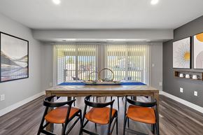 Troy apartment for rent - a dining room with a wooden table and four chairs at Sunnymede Apartments - Troy, MI, Troy, Michigan