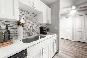 Wixom apartment for rent - a kitchen with white cabinets and a sink1 at Town & Country Apartments - Wixom, MI, Wixom