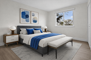 Canton townhouse for rent - A bedroom with a large bed and two nightstands.