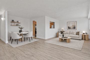 Southfield apartment for rent - A modern living room with a dining table and a couch.