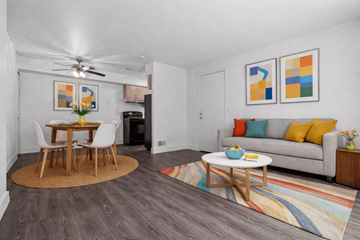 Canton townhouse for rent - A living room with a grey couch, a wooden table and a rug.