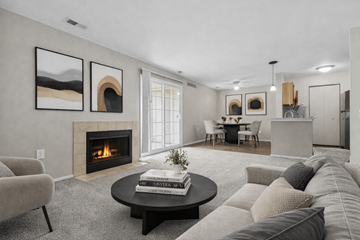Farmington Hills apartment for rent - A living room with a fireplace and a painting on the wall.