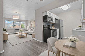 Plymouth apartment for rent - A modern kitchen with a dining table set for two.