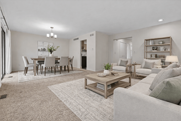 Farmington Hills apartment for rent - A living room with a grey couch and a coffee table.