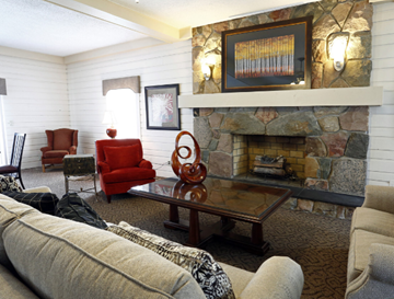 Southgate apartment for rent - the living room has a large stone fireplace and couches