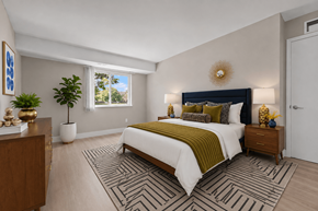 Troy apartment for rent - A bedroom with a large bed and a wooden dresser.