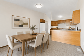 Saginaw townhouse for rent - A dining room with a wooden table and chairs.