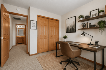 Saginaw townhouse for rent - A room with a desk and a chair.