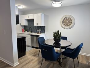 Royal Oak apartment for rent - A kitchen with a dining table and chairs. at The Park on 13 Apartments - Royal Oak, MI Apartments, Royal Oak, Michigan
