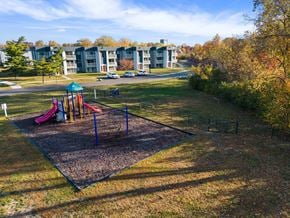 Riverview apartment for rent - a playground in a park with apartments in the background