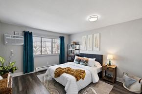 Riverview apartment for rent - a bedroom with a bed and a window with blue curtains