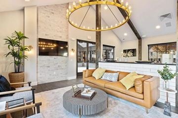 Grand Rapids apartment for rent - A living room with a leather sofa and a coffee table.