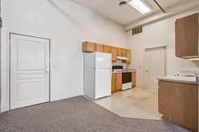 Clinton apartment for rent - A kitchen with white appliances and wooden cabinets.