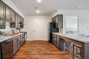 Mount Vernon apartment for rent - A kitchen with wooden floors and a white counter top.
