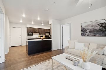 Marion apartment for rent - a living room and kitchen with a couch and a table