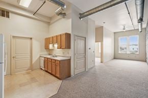 Clinton apartment for rent - A kitchen area with a refrigerator, sink, and cabinets.