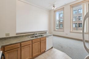 Clinton apartment for rent - A kitchen with wooden cabinets and a window.