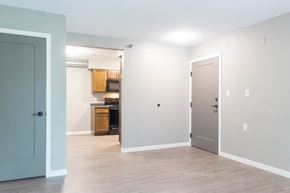 North Liberty apartment for rent - A kitchen area with a microwave, oven, and cabinets.