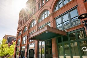 Sioux City apartment for rent - A building with a large window and a green awning.