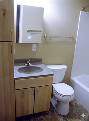 Columbus Junction apartment for rent - A bathroom with a toilet, sink, and bathtub.