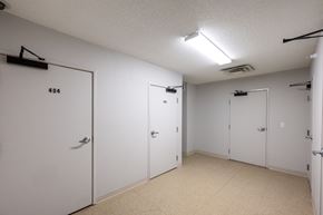 Sioux City apartment for rent - A white door with the number 404 on it is in a room with three other white doors.