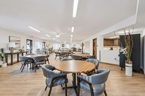 Des Moines apartment for rent - A conference room with a large table surrounded by grey chairs.