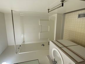 Sioux Center apartment for rent - A white bathroom with a glass shower door and a white toilet.