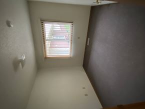 Sioux Center apartment for rent - A room with a window and a wall on the right side.