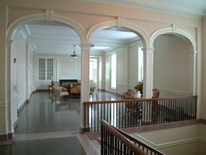 Mason City apartment for rent - A large open room with arches and a balcony.