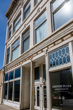 Sioux City apartment for rent - Century Plaza Apartments building with a blue sky in the background.