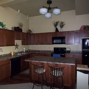 Spencer apartment for rent - A kitchen with a bar stool in front of the counter.