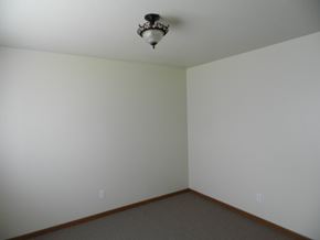 Cedar Rapids apartment for rent - A room with a light fixture on the ceiling and two switches on the wall.