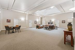 Clinton apartment for rent - A spacious room with a carpeted floor and furniture.