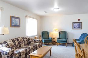 Moville apartment for rent - A living room with a sofa, chairs, and a coffee table.