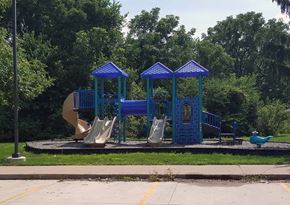 Columbus Junction apartment for rent - a playground with a slide and swings and a duck