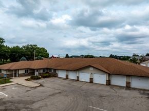 Hartley apartment for rent - A parking lot in front of a building with a brown roof.