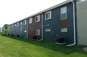 Cedar Rapids apartment for rent - A line of houses with different colored siding.