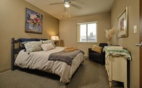 Spencer apartment for rent - a bedroom with a bed and a chair