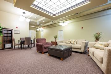 Spencer apartment for rent - A living room with a variety of furniture including a couch, chairs, and a coffee table.