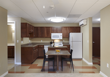 West Des Moines apartment for rent - a kitchen with a dining table and a refrigerator